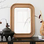 Boho-Chic Rattan Abaca Sunburst Wall Mirror at entryway